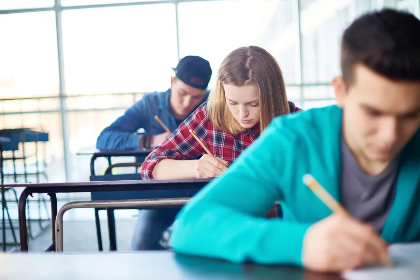 A student practicing for the GCSE English Online Test on a laptop