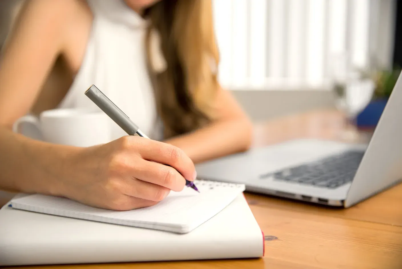 A focused individual practicing with the UKISET test sample questions on a tablet